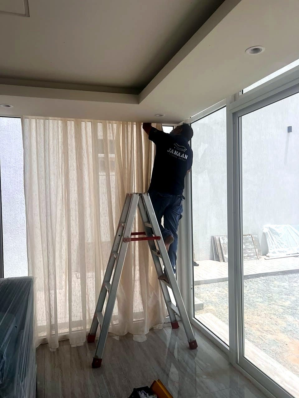 Curtain installation in a Dubai home
